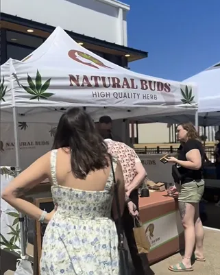 The Natural Buds tent at a Fort Worth community event
